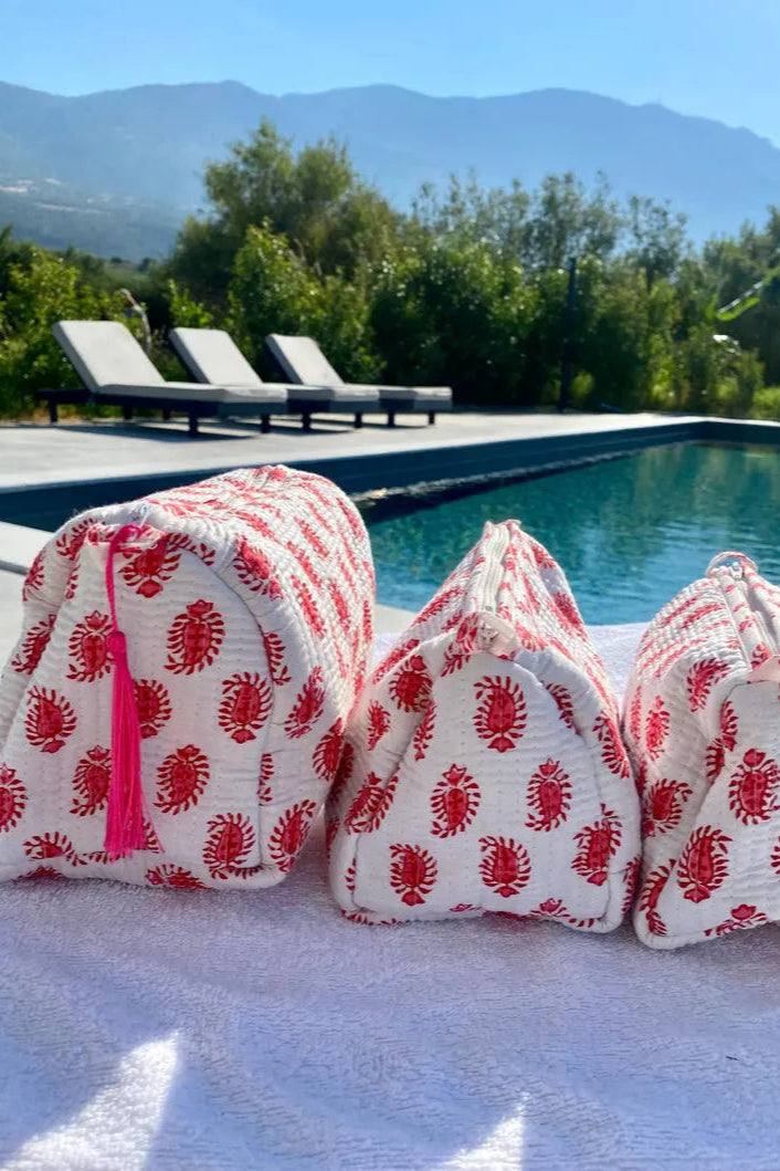 red and white block print toiletry set