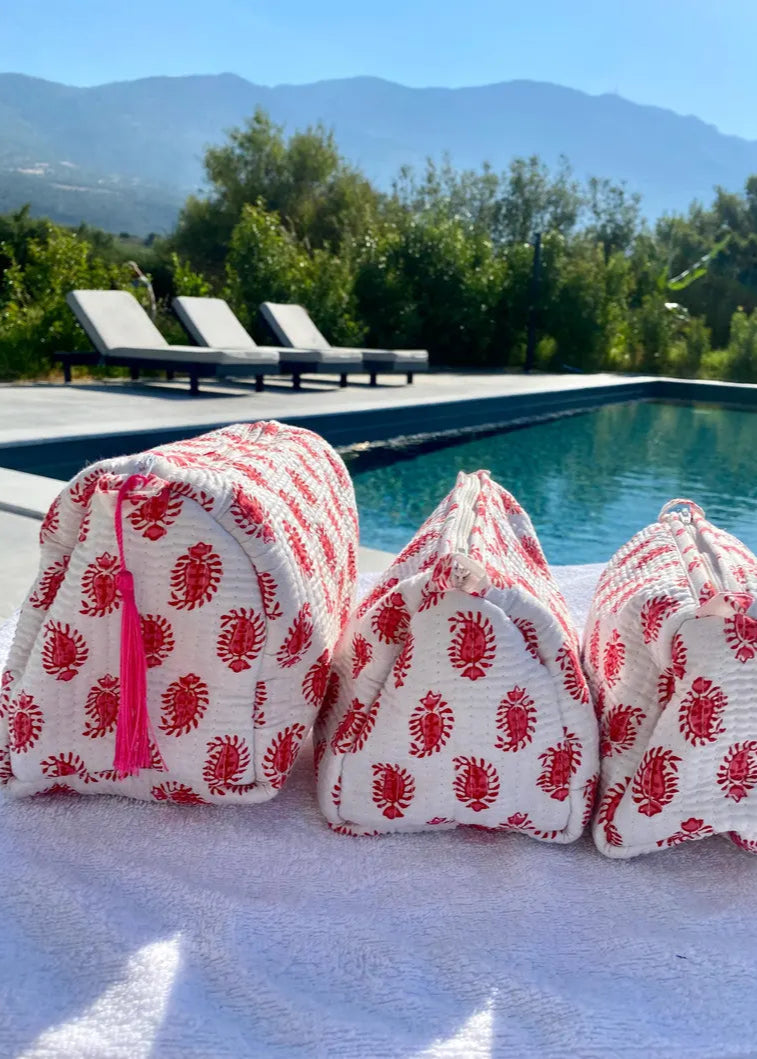 red and white block print toiletry set